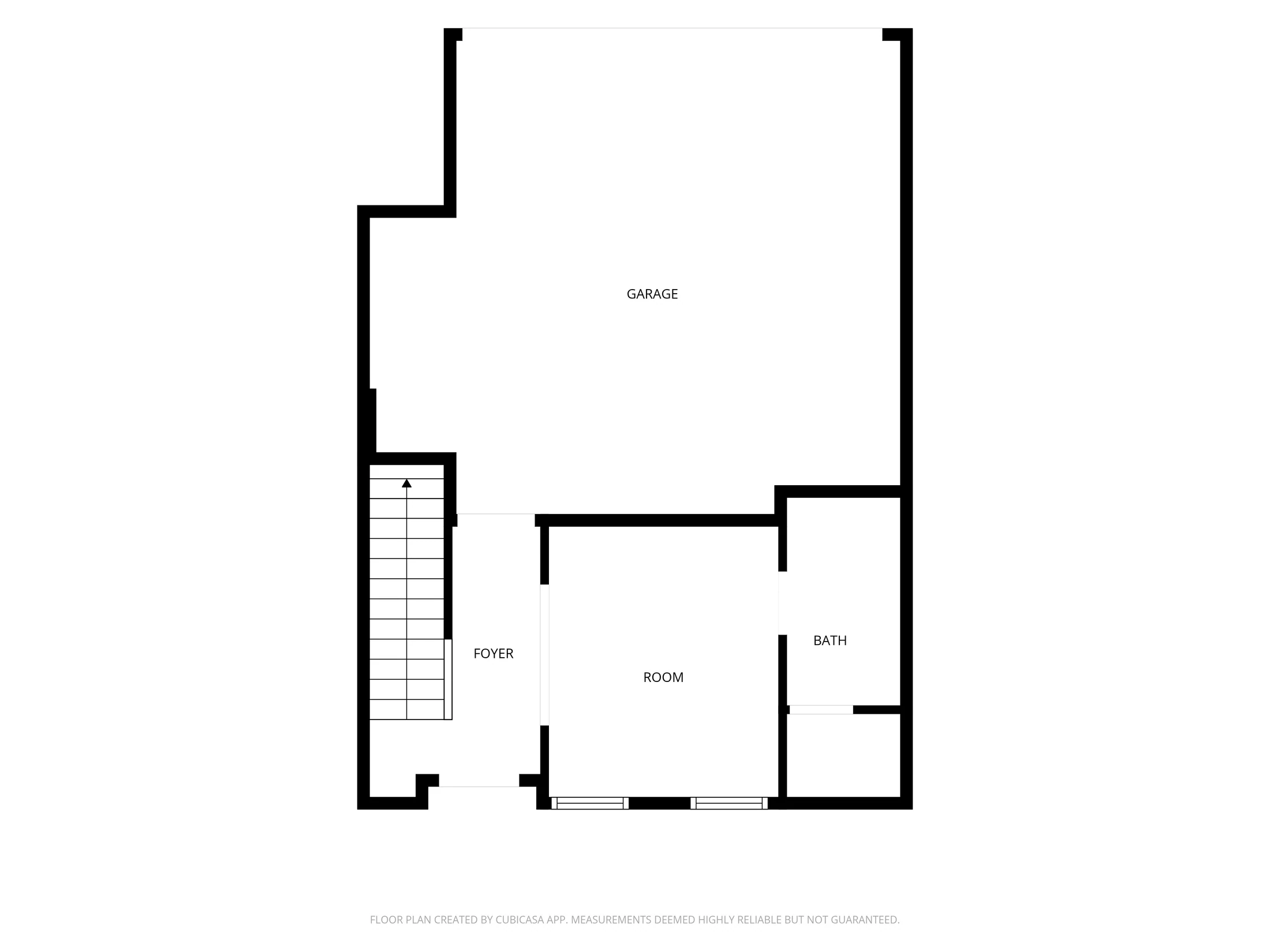First-floor plan with garage, foyer, room, and bathroom