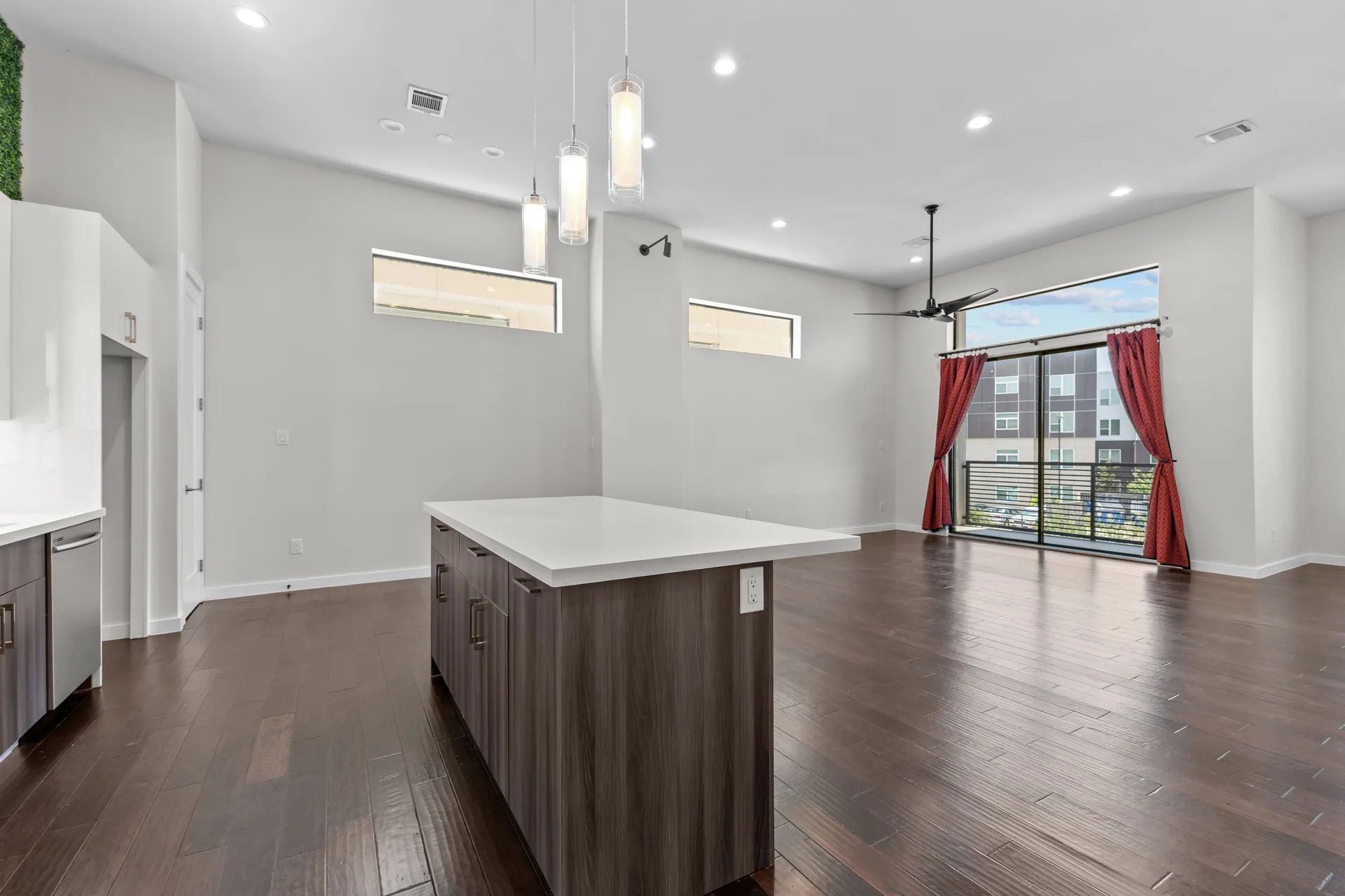 Open kitchen and living area with dark wood floors