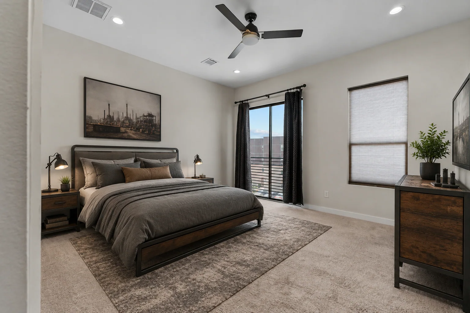 Bedroom after professional staging with a bed, side tables, rug, and decor