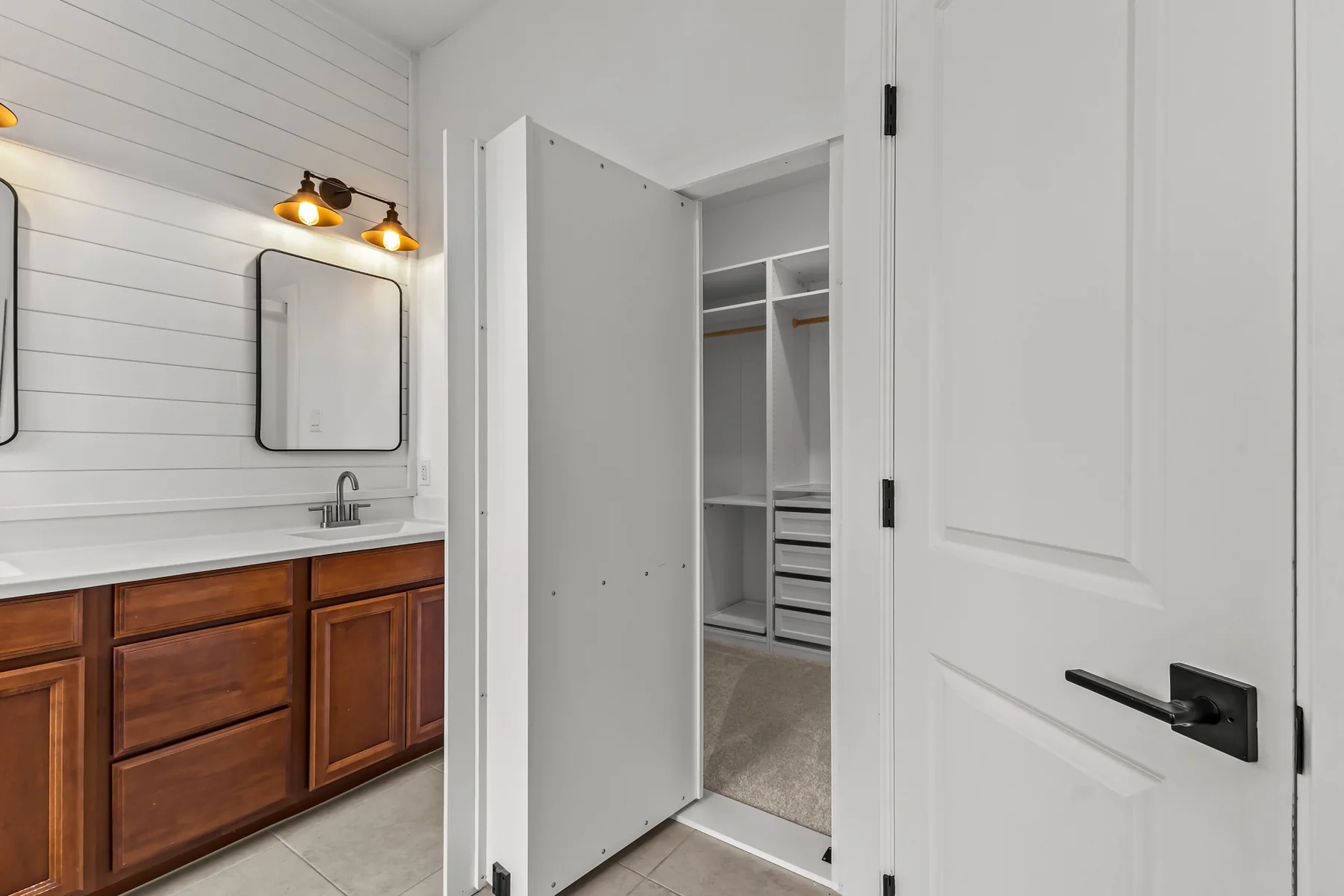 Walk-in closet with built-in shelving and storage