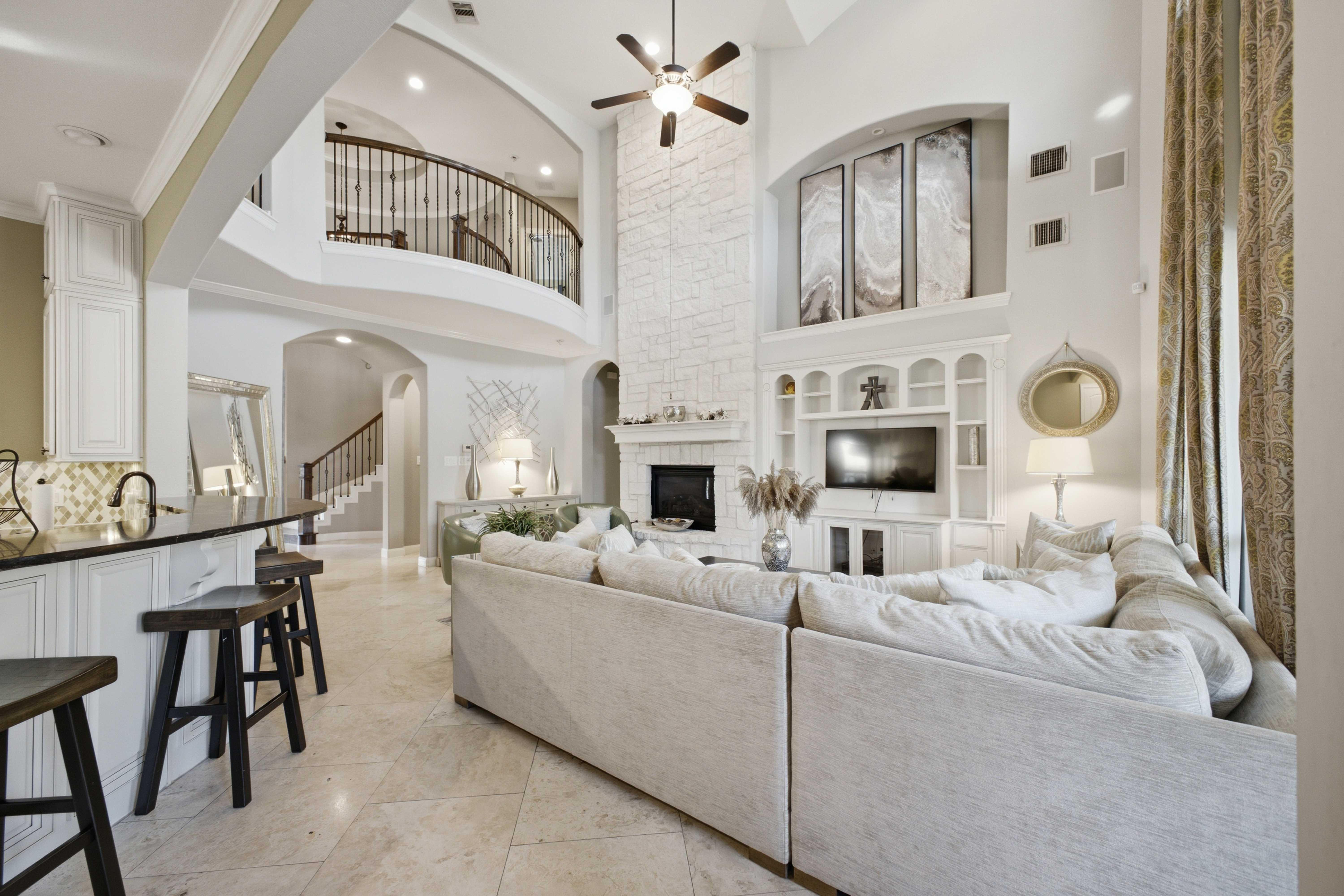 Beautiful white modern open living room with high ceilings