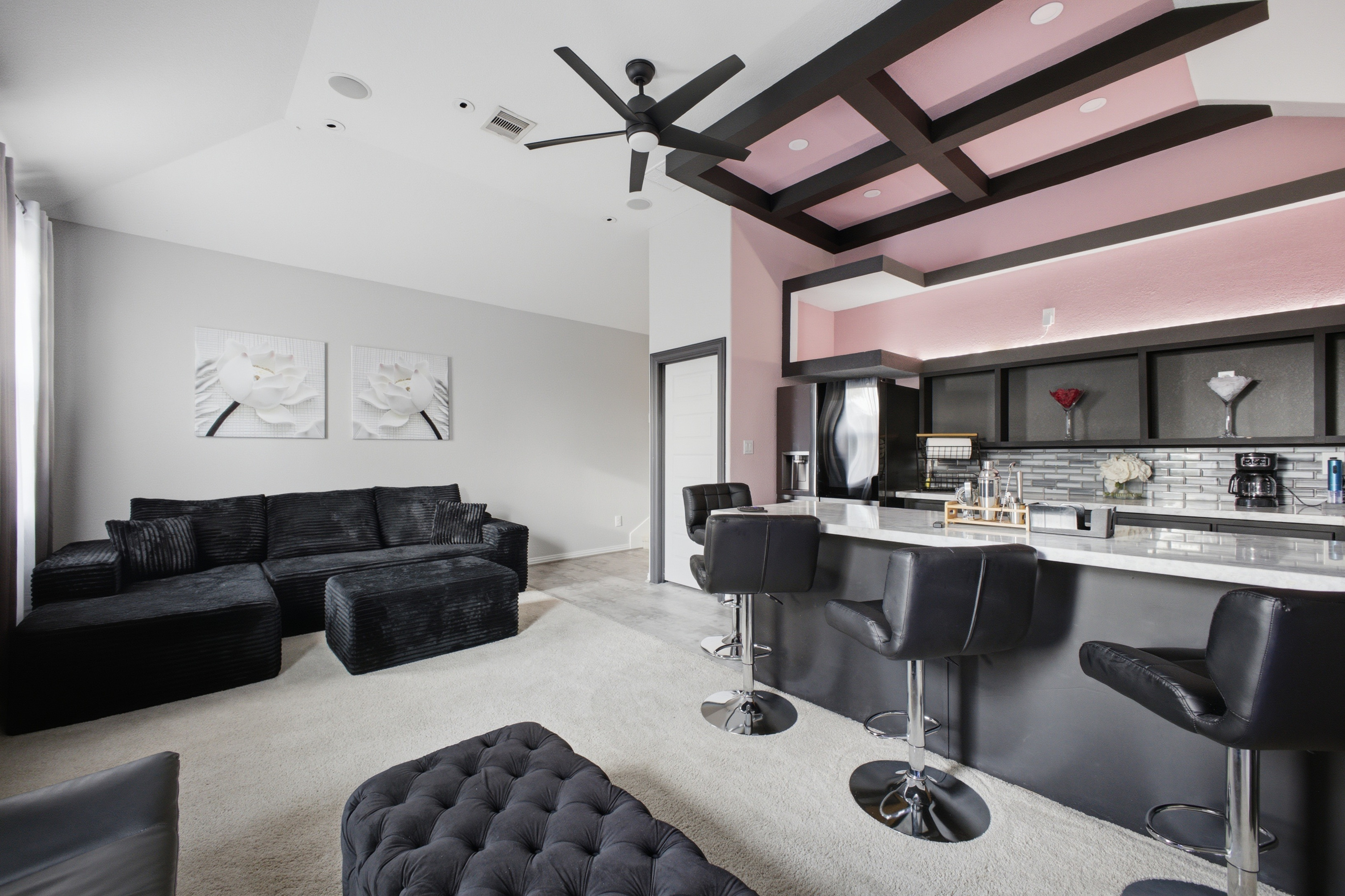 Entertainment room with lounge seating and custom wet bar