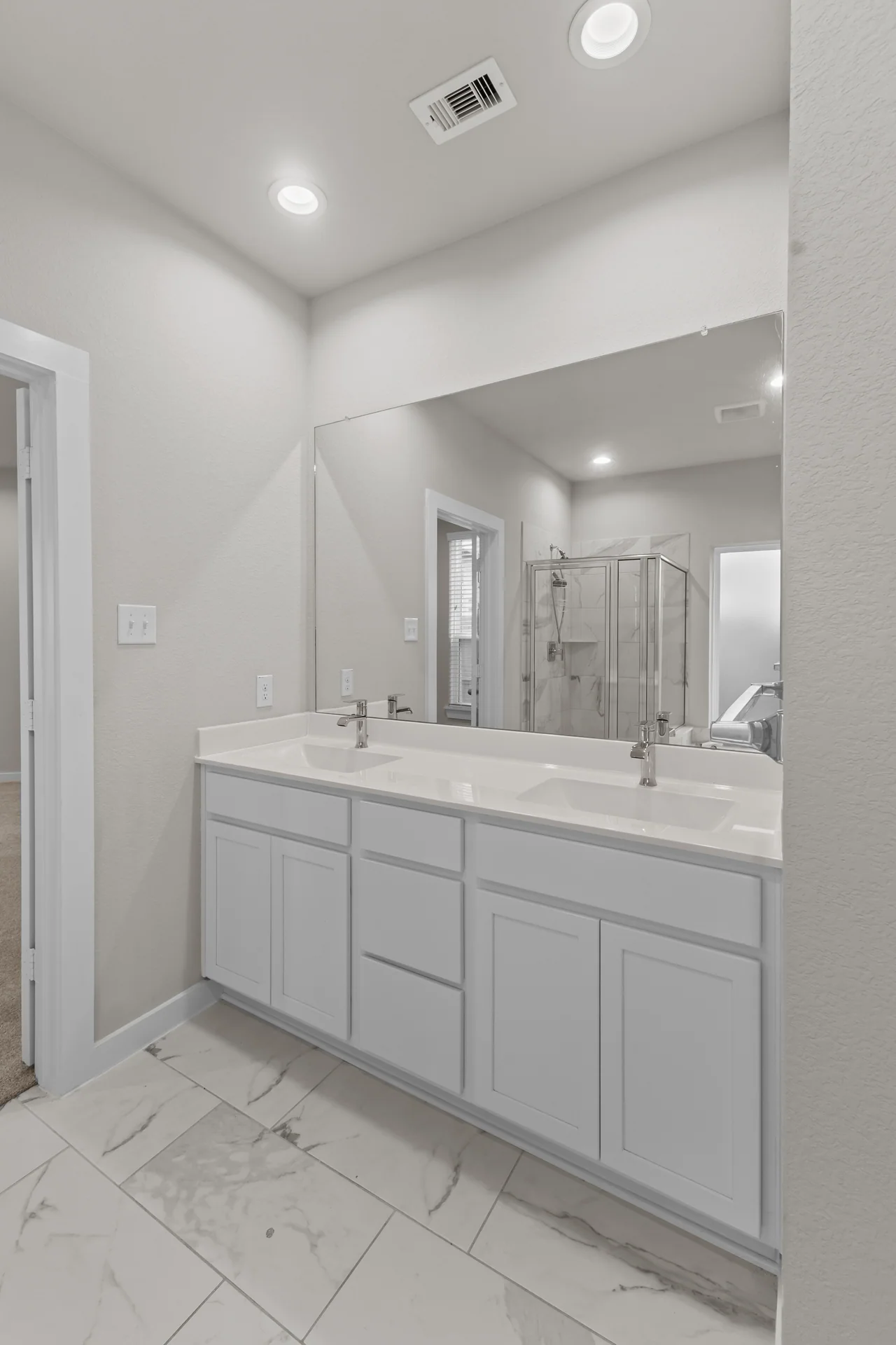 Alternate view of a residential primary bathroom